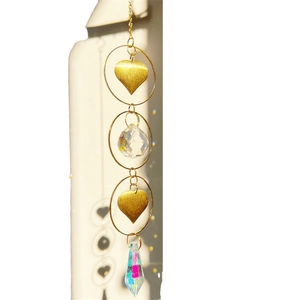 Golden hanging crystal suncatcher with moon and star metal accents and clear crystal prisms