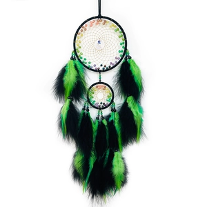 Handmade black and green feather dreamcatcher with crystal beads on a white background