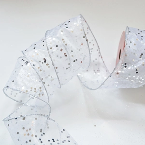 Detail of white sheer chiffon ribbon with sparkling silver sequins for gift wrapping