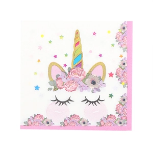 Close-up of unicorn party napkins with pink floral patterns and colorful stars