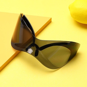 Detail of oversized punk mask sunglasses with one-piece lens on yellow fashion background