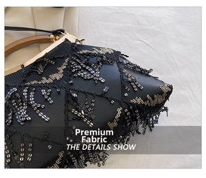 Detail of evening clutch bag with black and silver sequins, fringe, and a metal frame