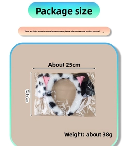 Detailed size measurement of spotted dog headband in packaging showing 25cm width and 17cm height
