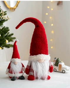 Detail of red and white Christmas gnomes with knit fabric texture and warm lights