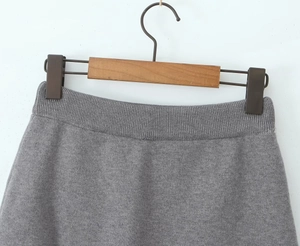 Close-up of the elastic waist detail on this grey knitted skirt for women