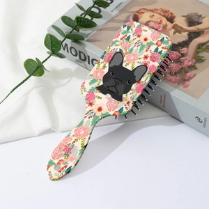 Detail of air cushion hairbrush featuring cute French Bulldog and floral illustration