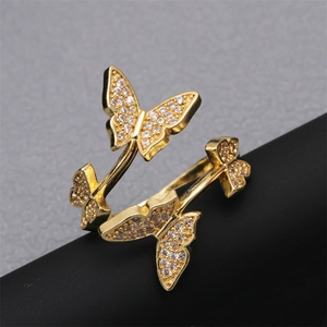 Adjustable golden open ring featuring four micro-set cubic zirconia butterflies