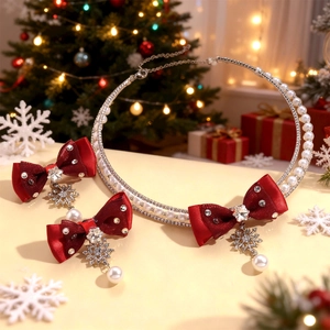 Close-up of Christmas jewelry set with red ribbon bows, pearls and snowflake pendants