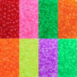 Macro detail of multi-colored transparent acrylic pony beads with large holes for DIY crafts