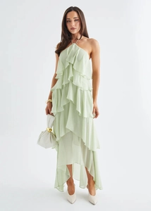 Detail of light green chiffon evening dress with tiered ruffles and halter neckline