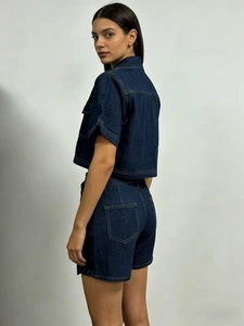 Deep blue denim two-piece set featuring short-sleeve jacket and irregular hem skorts