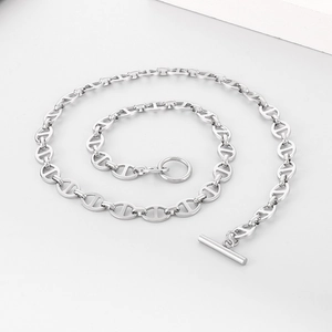 Minimalist silver pig nose chain necklace with OT toggle clasp on white background