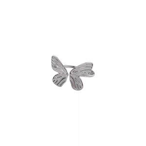 Detail of silver S925 butterfly open ring showing textured wings and polished finish