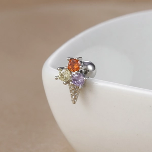 Detailed macro view of 18K stainless steel lollipop ice cream stud with tricolor gems