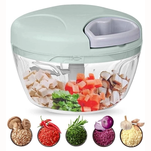 Manual food chopper with sharp blades and containers showing chopped vegetable results