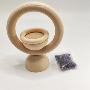 Detailed view of a vertical wooden ring diffuser stand with purple amethyst crystals