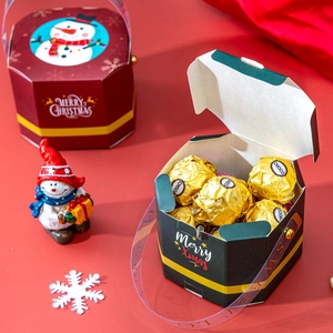Octagonal Christmas gift boxes in red and green with snowman motifs and hand straps