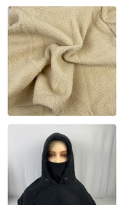 Detail of high-thermal fleece texture and integrated windproof hooded face mask design