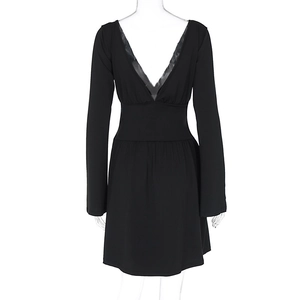 Close-up of black V-neck dress featuring delicate lace trim and cinched waist detailing