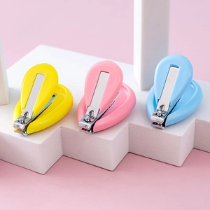 Shell-shaped safety nail clippers for babies in yellow, pink and blue colors