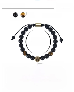 Detail of 8mm tiger eye and matte stone beads with adjustable hand-woven cord