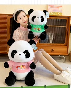 Detailed view of two adorable panda plush toys wearing pink and green China T-shirts