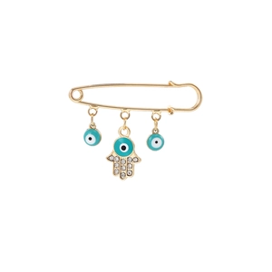 Detailed close-up of golden brooch with Hamsa Hand and blue Evil Eye tassel pendants