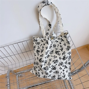 Floral cotton tote bag detail featuring vintage black flower patterns and long shoulder straps