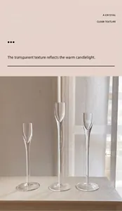 Three clear glass candle holders in different heights for elegant table settings