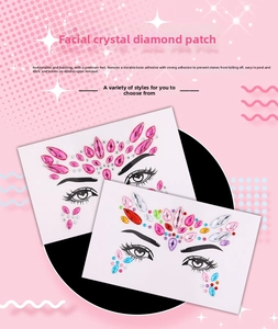 Close-up of pink and multicolor rhinestone face stickers for festival makeup on cardboards