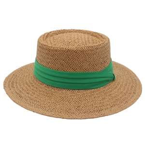 Flat top straw boater hat with vibrant green ribbon band for summer sun protection