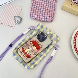 Detail of yellow and blue plaid phone bag with purple lanyard and knot accents