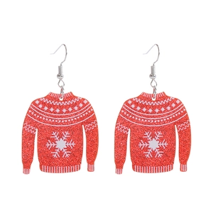 Detail of festive glitter red sweater earrings with white snowflake and polka dot patterns