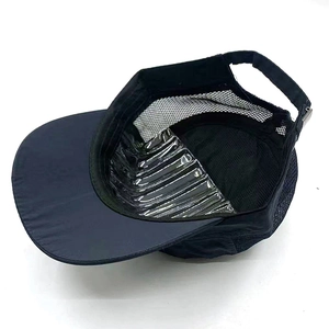 Detail of navy blue sports cap showing breathable mesh back and adjustable strap