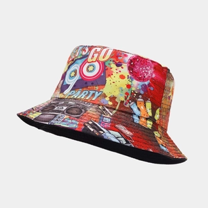 Close-up of 90s party bucket hat with colorful graffiti prints and boombox patterns
