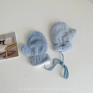 Detail of light blue plush mittens featuring thick fleece lining and neck strap lanyard