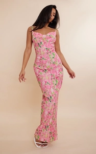 Detail of slim-fit pink floral maxi dress featuring fine pleated fabric and thin straps