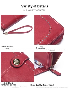 Close-up of red pebbled leather long wallet showing metal zipper and wrist strap detail