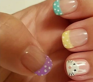Detailed close-up of Easter press-on nails featuring cute bunny patterns and colorful polka dots