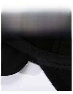 Macro shot of the wide moisture-wicking sweatband inside a black thermal baseball cap
