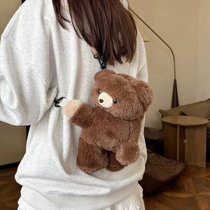 Rear view of model wearing a cute brown teddy bear plush backpack in a cozy home setting
