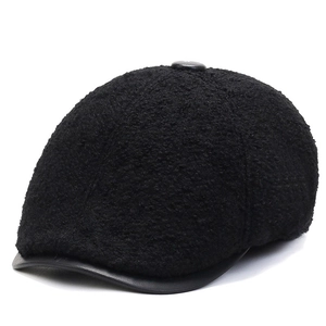 Men's winter forward cap with warm black faux fur and matte leather patchwork design