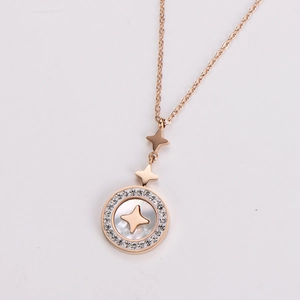 Macro detail of rose gold hexagram star necklace with shell inlay and crystal halo