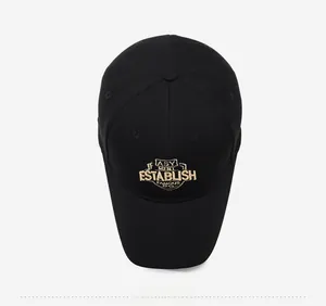 Top view of a black cotton baseball cap featuring detailed 3D gold embroidery design