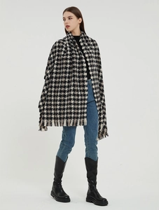 Classic black and white houndstooth shawl with fringe detail and knit texture