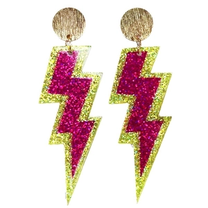 Detailed view of oversized lightning bolt earrings with hot pink and neon green glitter finish
