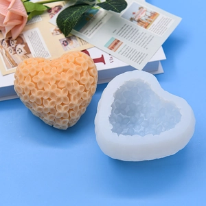 Flower heart silicone mold for DIY handmade soap or candle making on blue background