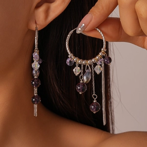 Bohemian silver hoop earrings with purple crystal beads and asymmetrical metal tassels