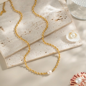 Elegant natural freshwater pearl necklace on beige marble with sea shells, 18K gold plated