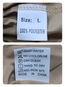 Makroansicht der Größen- und Pflegeetiketten auf der khakifarbenen Twill-Webhose für Herren